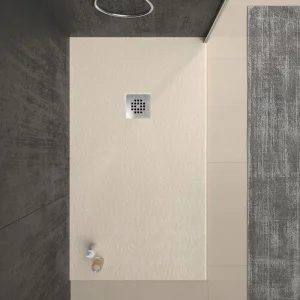 Plato
  ducha resina ONE Crema RAL 1013 y otros colores exclusivos con textura
  pizarra antibacteriano y antideslizante. Rejilla inox